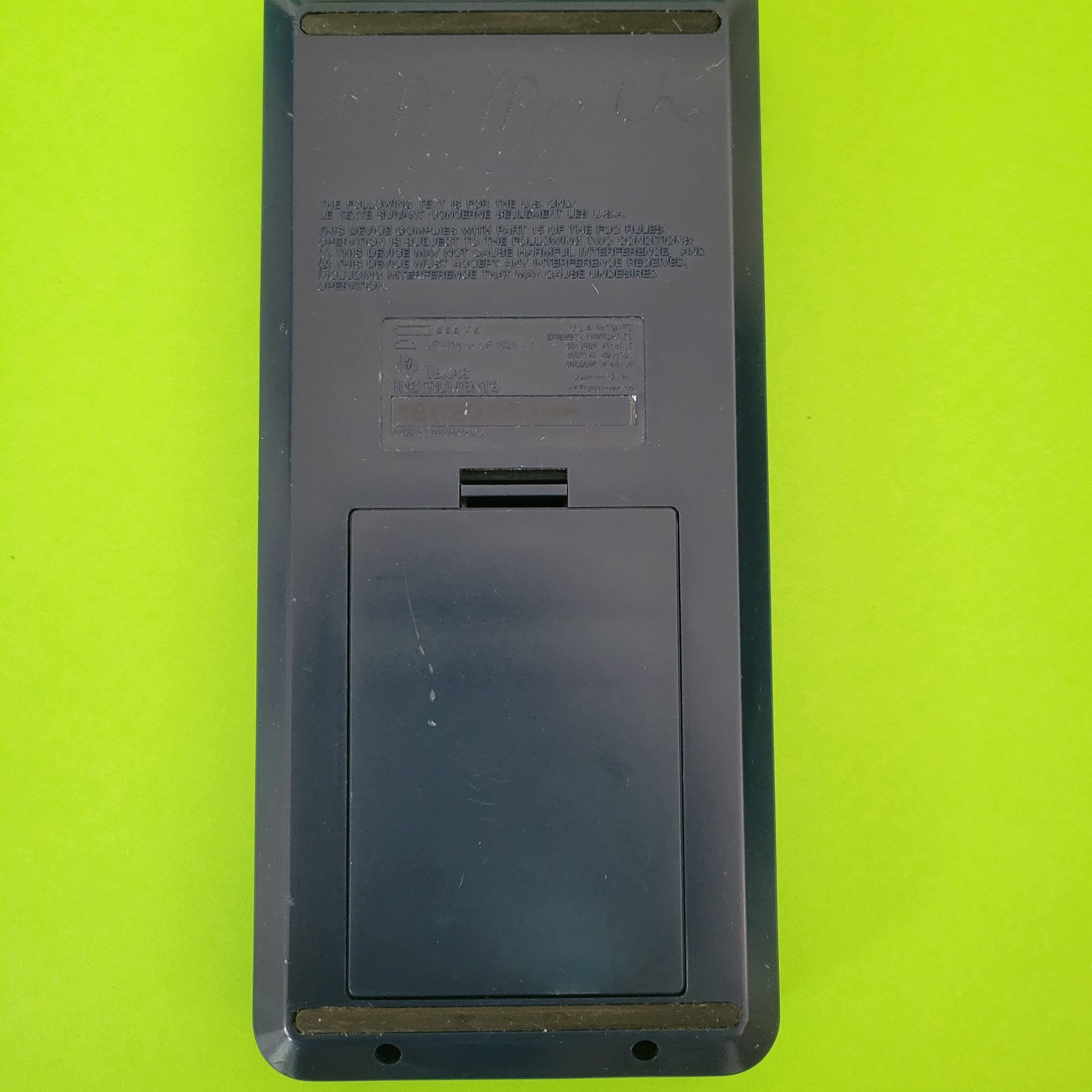 An image of the back of a texas instruments ti-81 graphing calculator